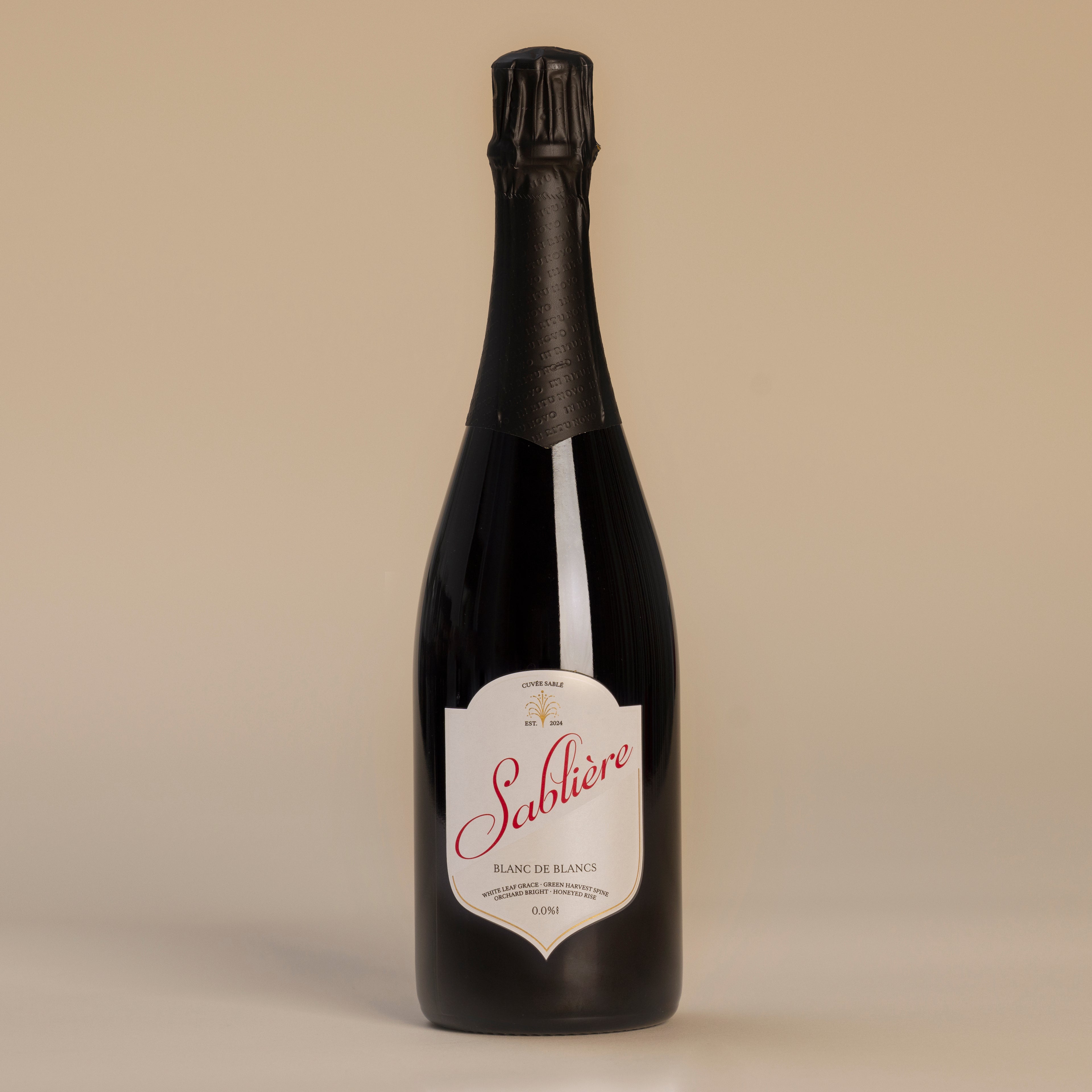 Bottle of Sableère wine with a beige label on a beige background